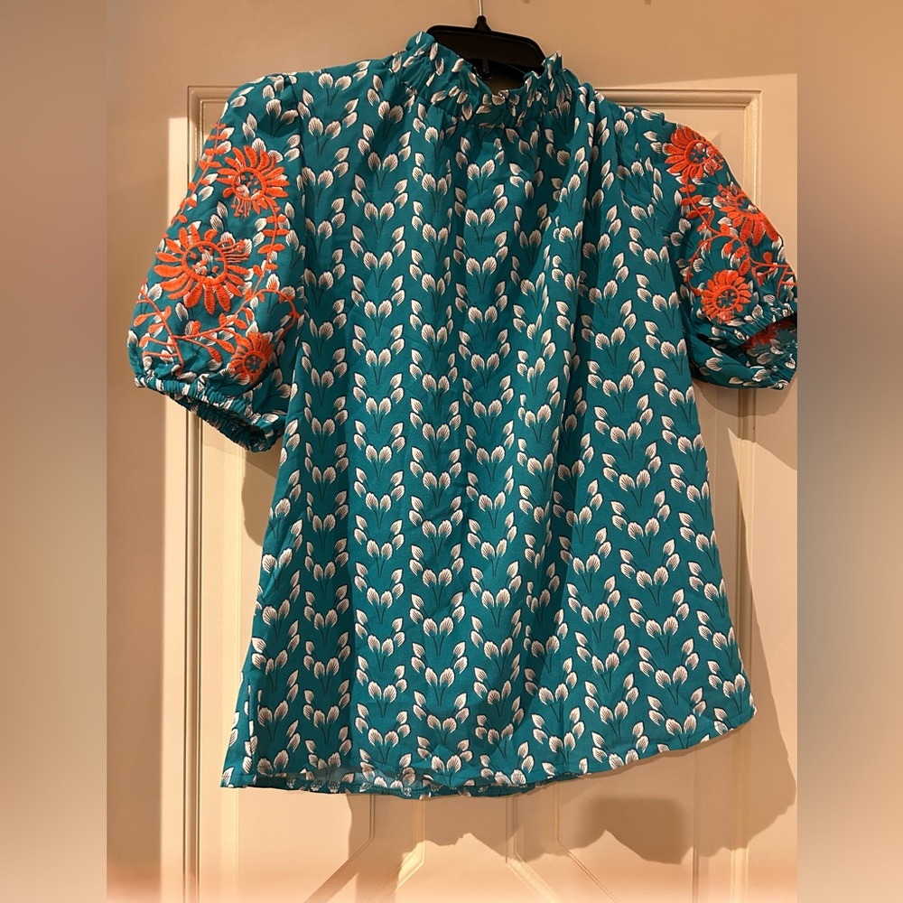 Green pullover top with elastic neck floral print